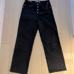 Black Levi button fly jeans.